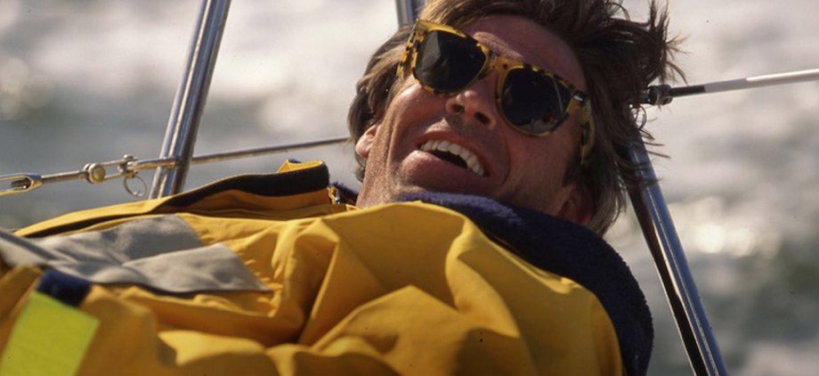 Man sailing in yellow anorak & tortoiseshell sunglasses