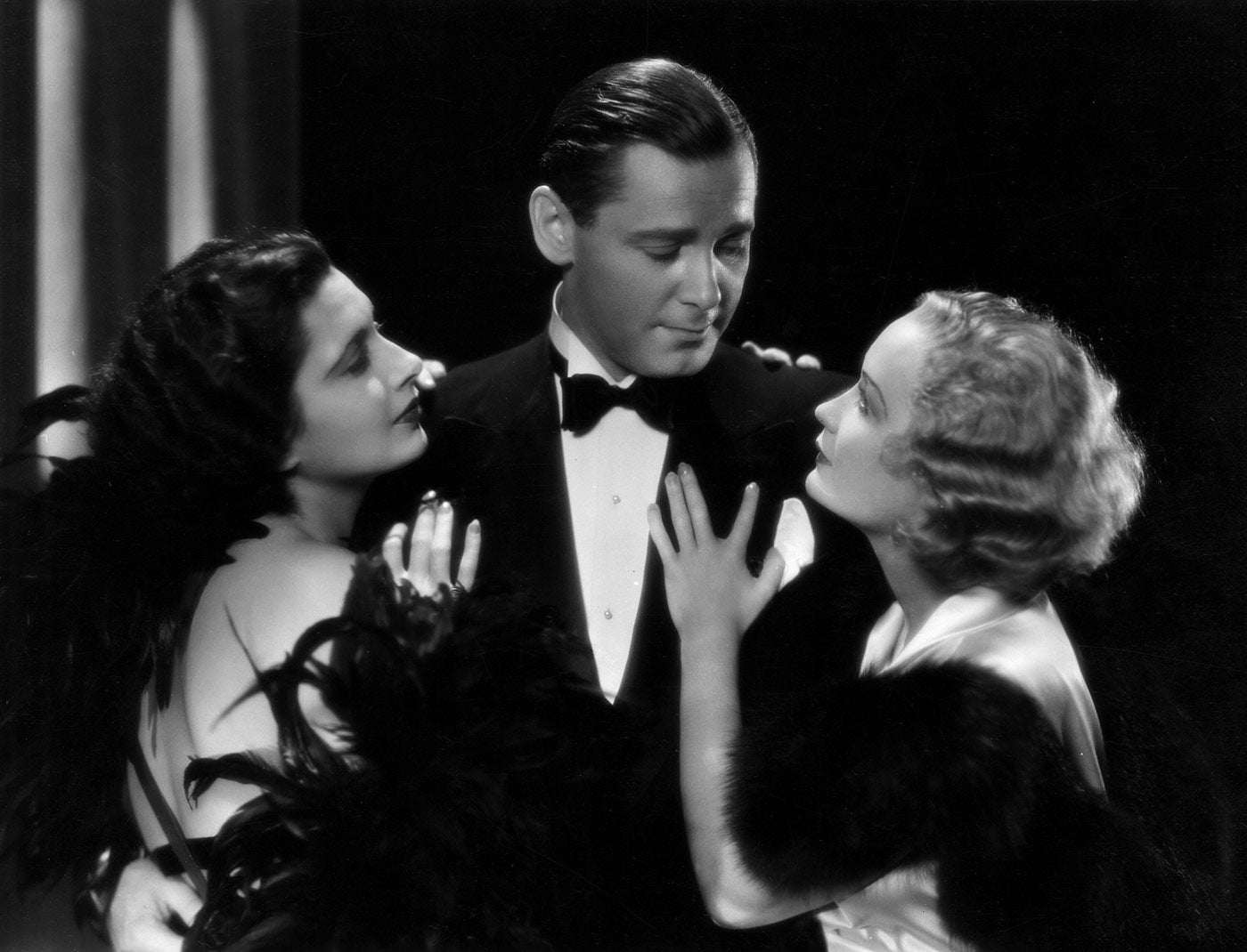 (Left to right) Kay Francis, Herbert Marshall, and Miriam Hopkins starred in the 1932 Ernst Lubitsch classic <em>Trouble in Paradise</em>