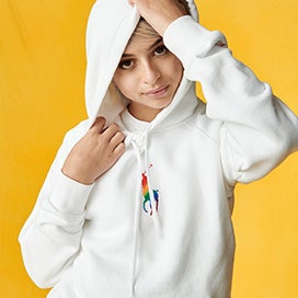 Josie Totah in white hoodie with small rainbow Polo Pony graphic