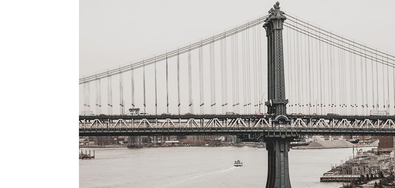Photograph of city bridge on cloudy day