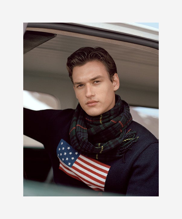 Man in navy American flag sweater