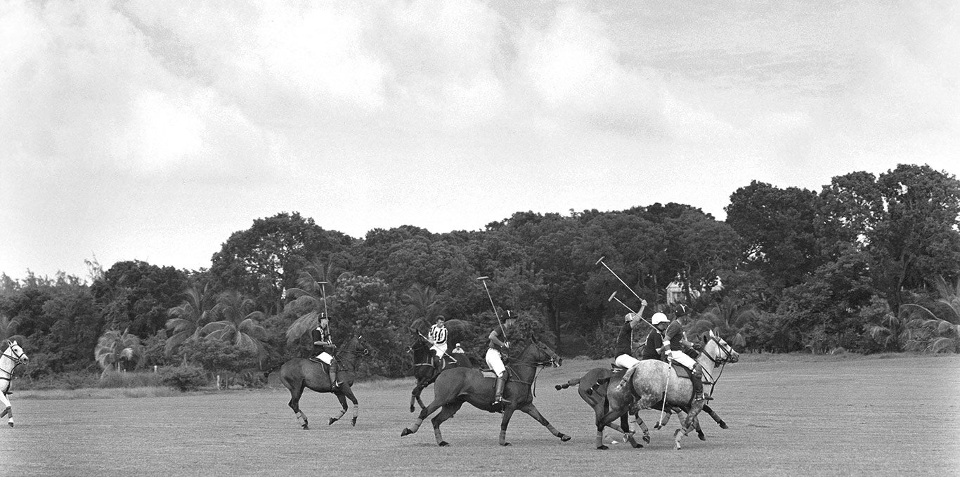 Greyscale image of polo match