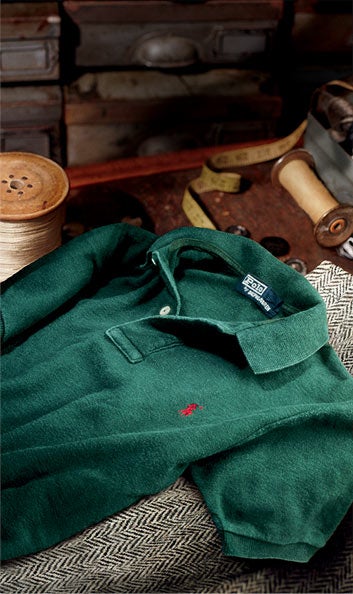 Photograph of vintage weathered green Polo shirt on trunk