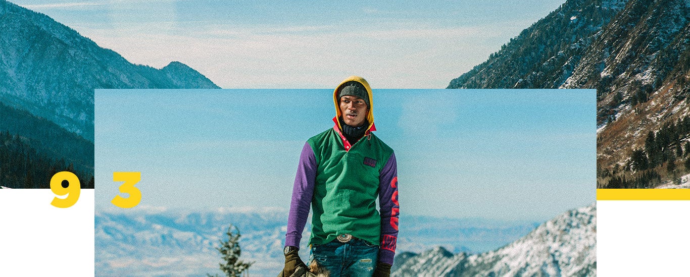 Model on snowy mountain in color-blocked Snow Beach hooded pullover