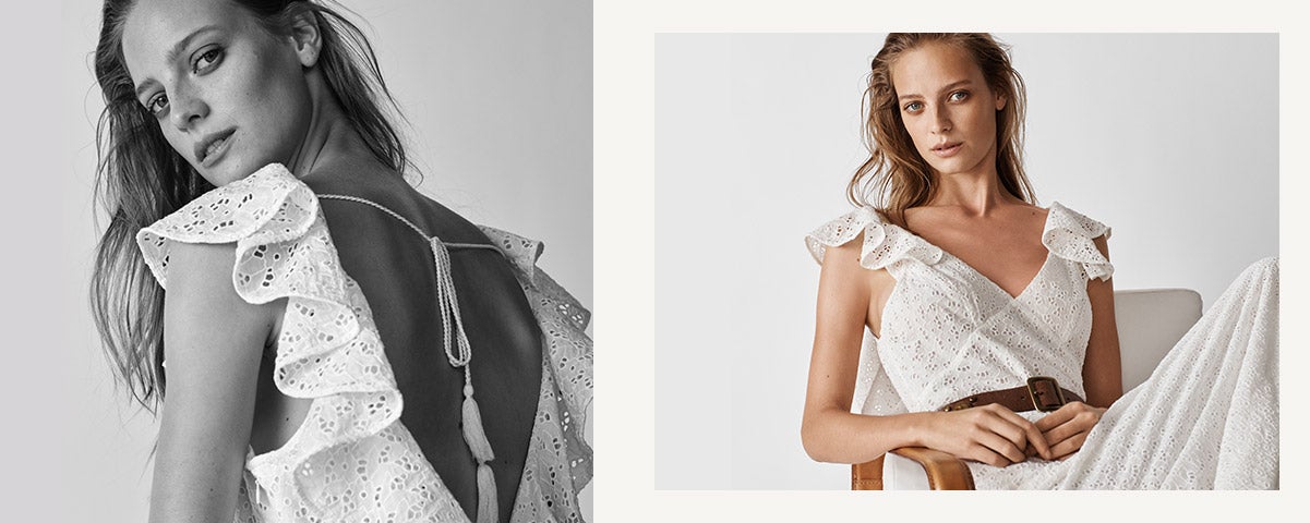 Woman wears white eyelet dress with flutter sleeves.