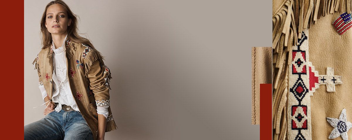Woman in jacket with fringe and Western embroidered accents throughout