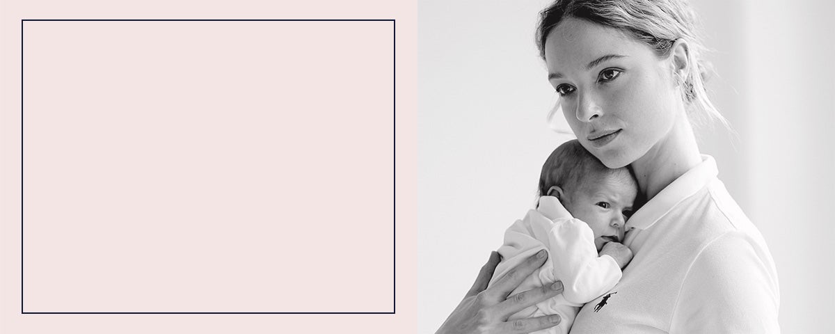 Mom in white Polo shirt holding newborn