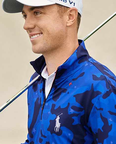 Justin Thomas in blue camo pullover with Polo Pony at chest