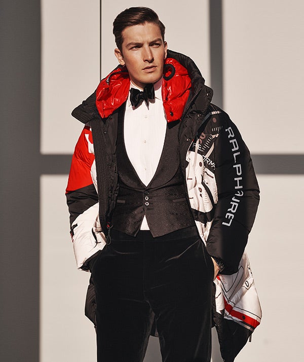 Man in black, red & white parka with ski-inspired graphics