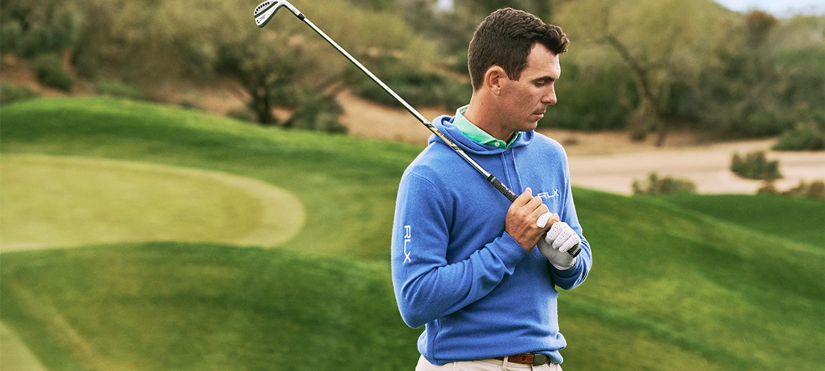 Billy Horschel wears blue RLX hoodie.