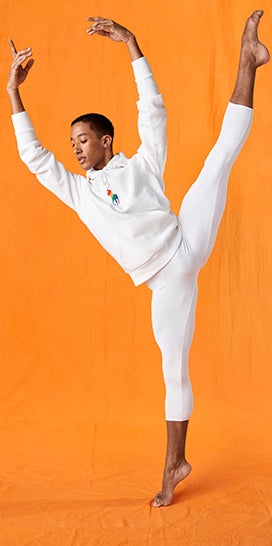 Harper Watters in white hoodie with large rainbow Polo Pony graphic