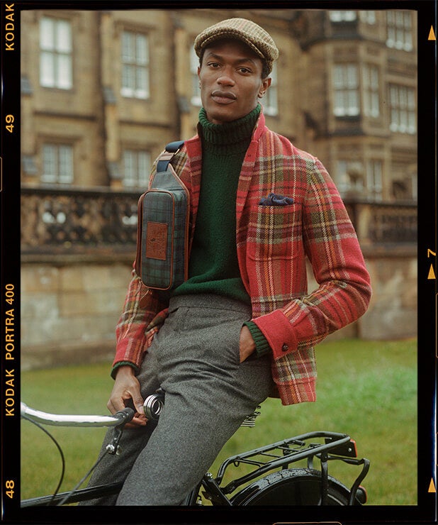 Man in red, green & yellow plaid sport coat layered over turtleneck