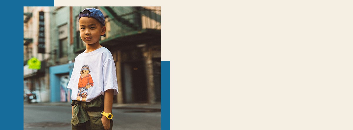 Boy wears Palm Springs Polo Bear tee and backwards cap.