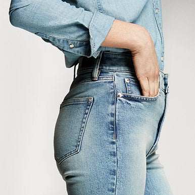 Close-up of comfort stretch denim in medium wash
