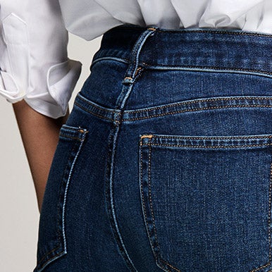 Close-up of back of light-wash ultimate stretch jeans