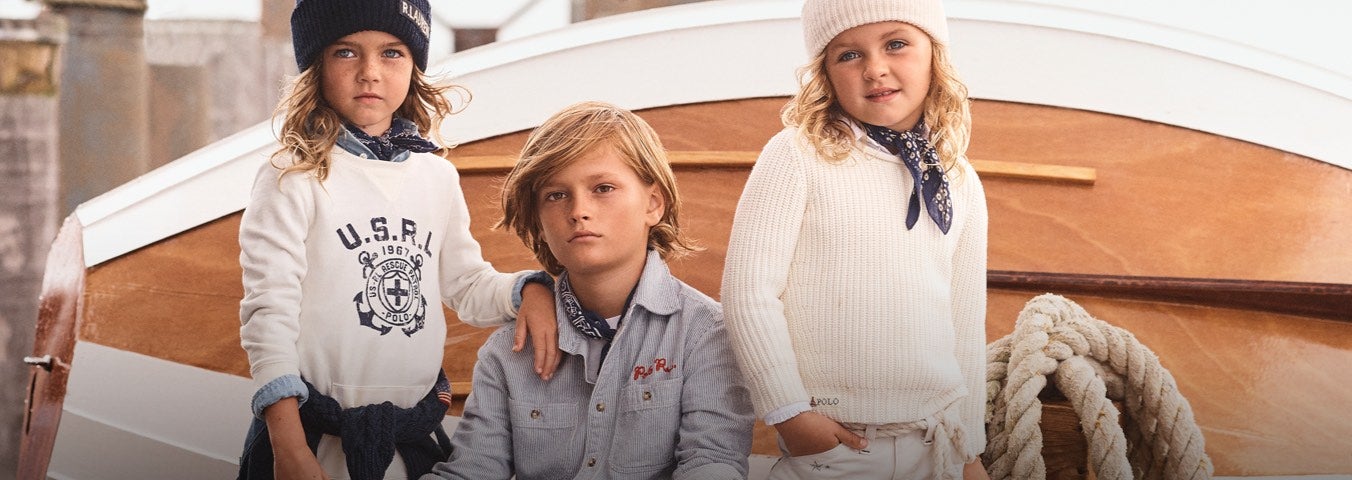 Kids wear white and blue nautical Polo attire.
