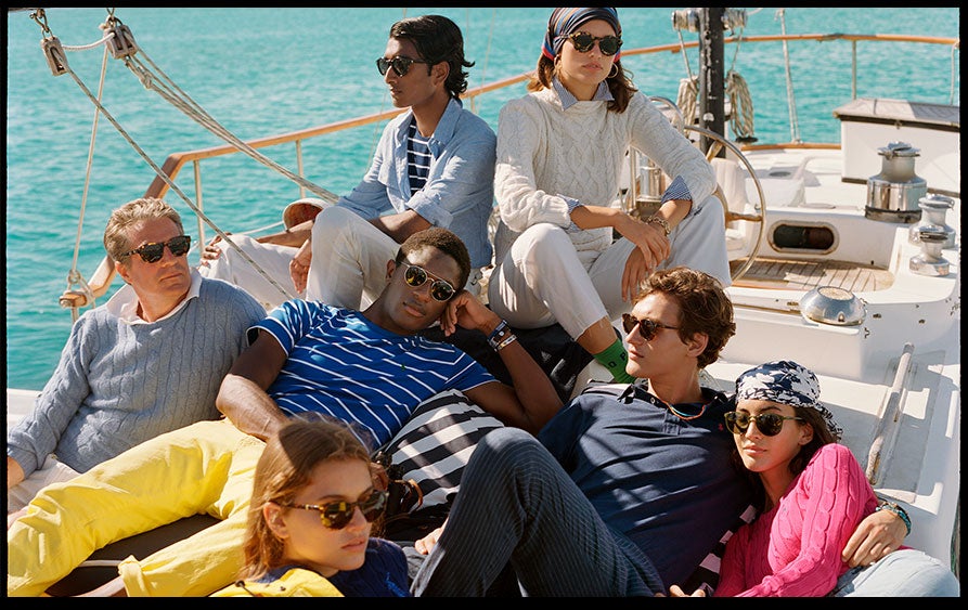 Men & women relaxing on yacht in Polo beach styles