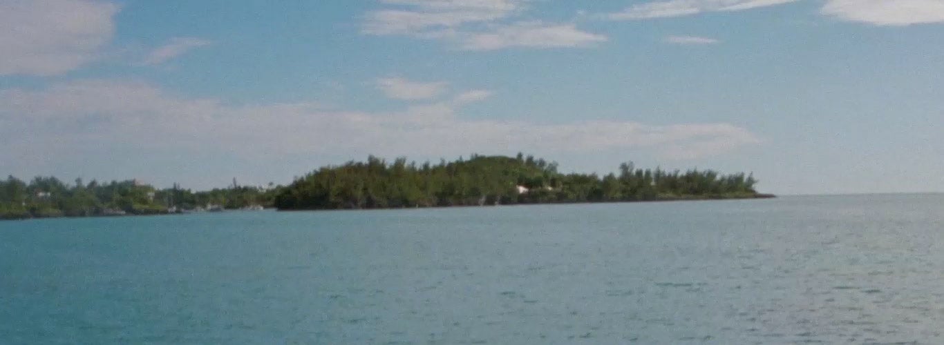 Video of women on boat & beach in colorful warm-weather styles