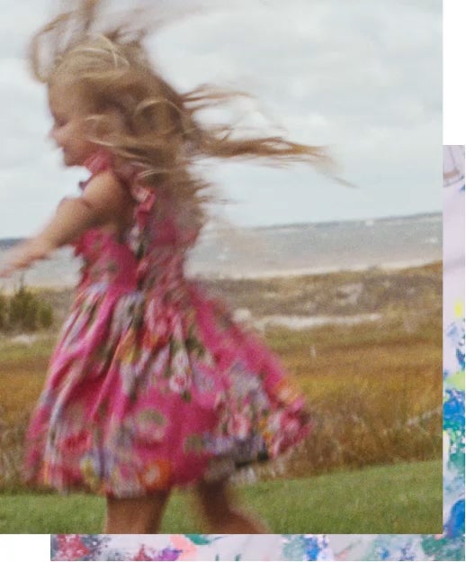 Girl twirls in pink floral dress
