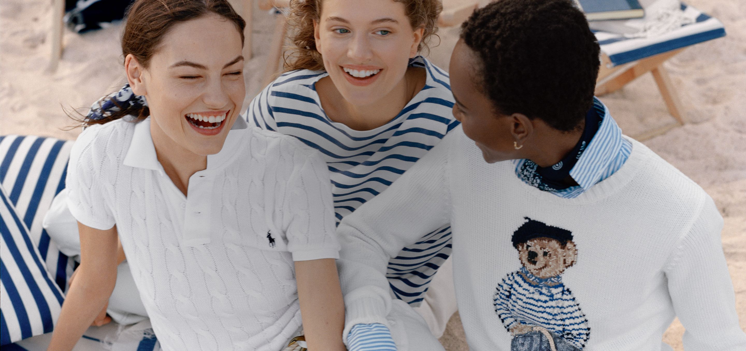 Three women on beach in classic Polo styles