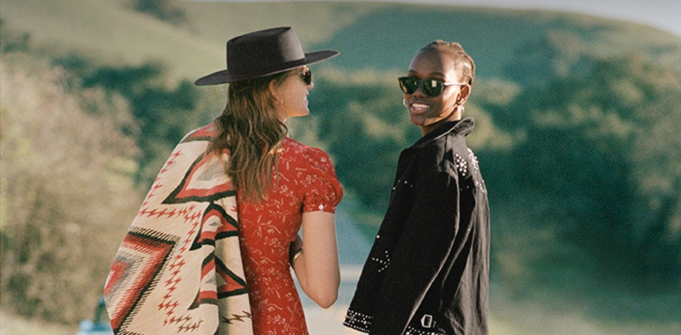 Women in Southwestern-inspired & floral styles walking down road