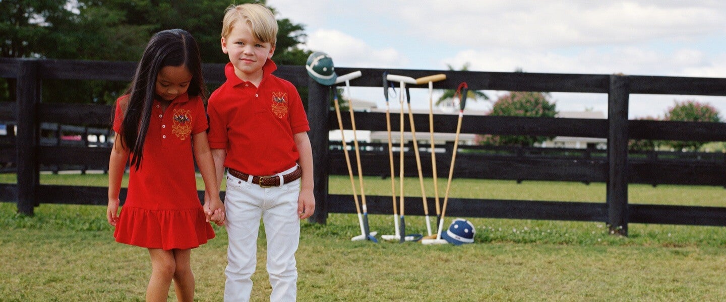 Girl wears red Polo dress; boy wears red Polo shirt.