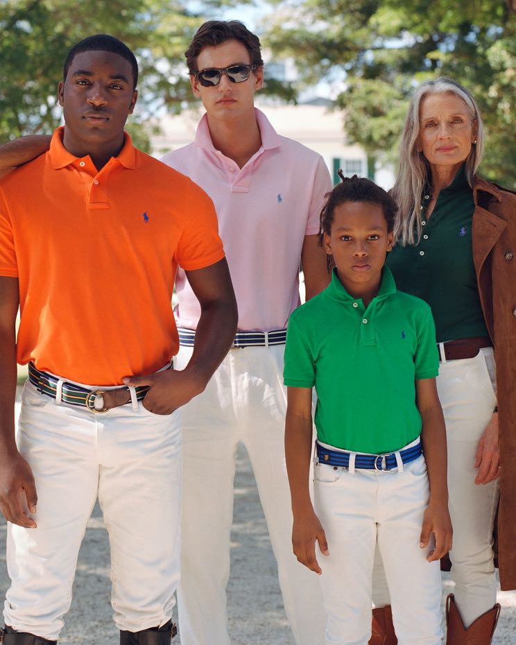 Girl on horse wears purple Polo shirt.