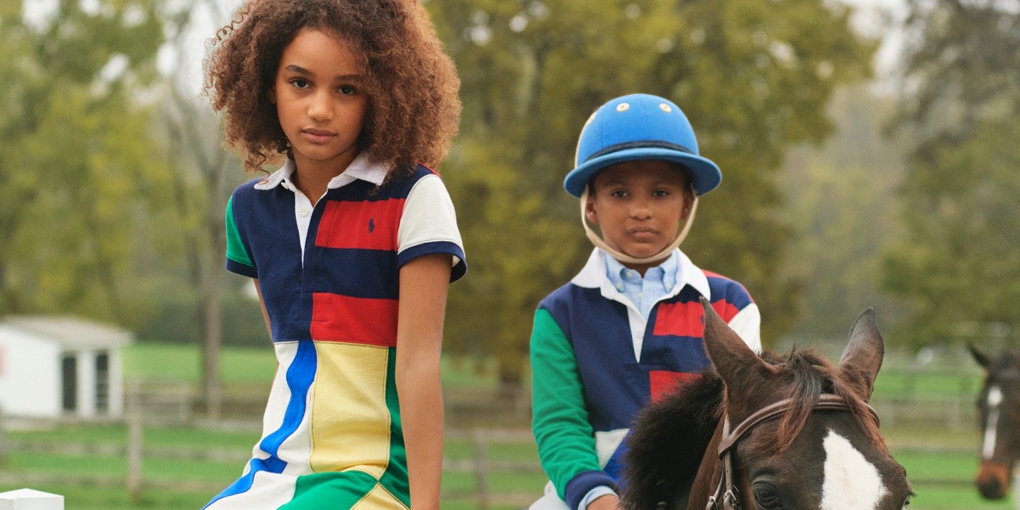Girl & boy in color-blocked styles at horse stables