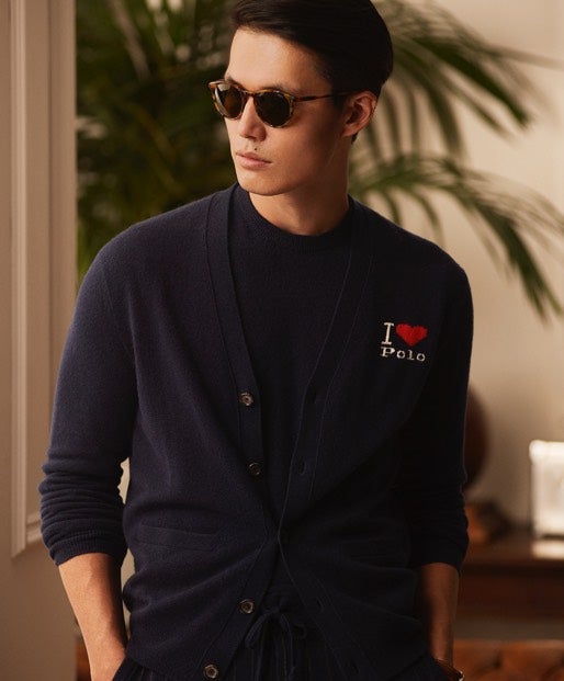 Woman in navy hoodie with white lace-up placket