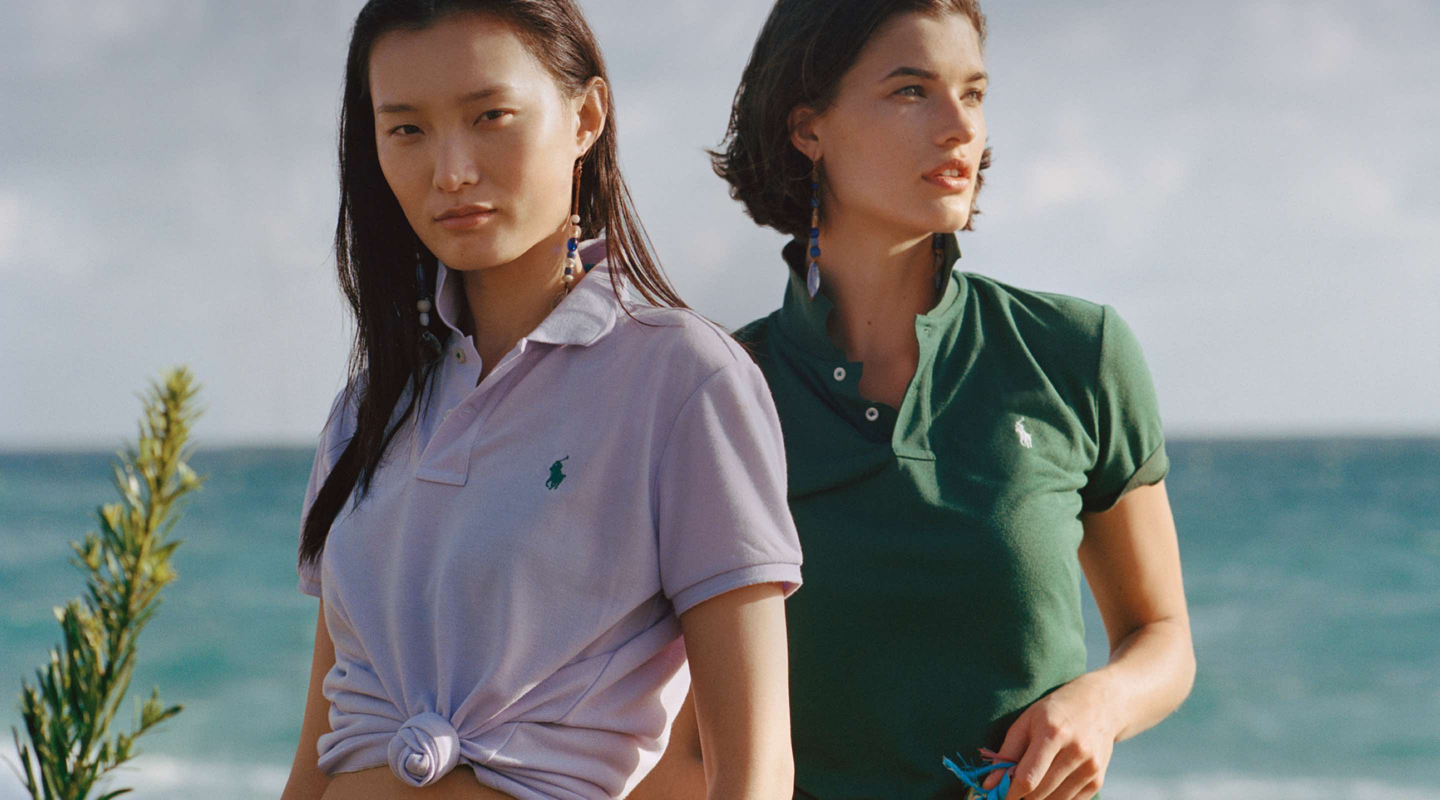 Women in light pink & green Earth Polos