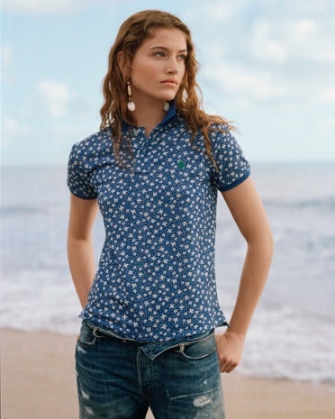 Woman in printed blue Earth Polo