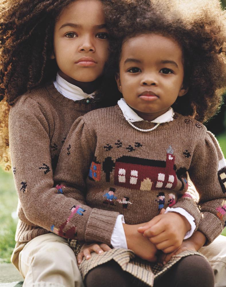 Sisters wearing knit vintage - inspired schoolhouse sweaters