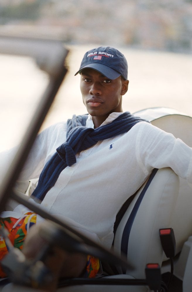 Man in white linen button-down shirt with Polo Pony accent